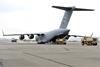 Two High Mobility Artillery Rocket System vehicles are loaded onto a C-17 Globemaster III c USAF