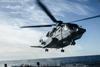 Royal Canadian Air Force CH-148 Cyclone helicopter lands on Royal Canadian Navy ship c RCAF