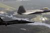 F-22 and T-38 over Tyndall AFB