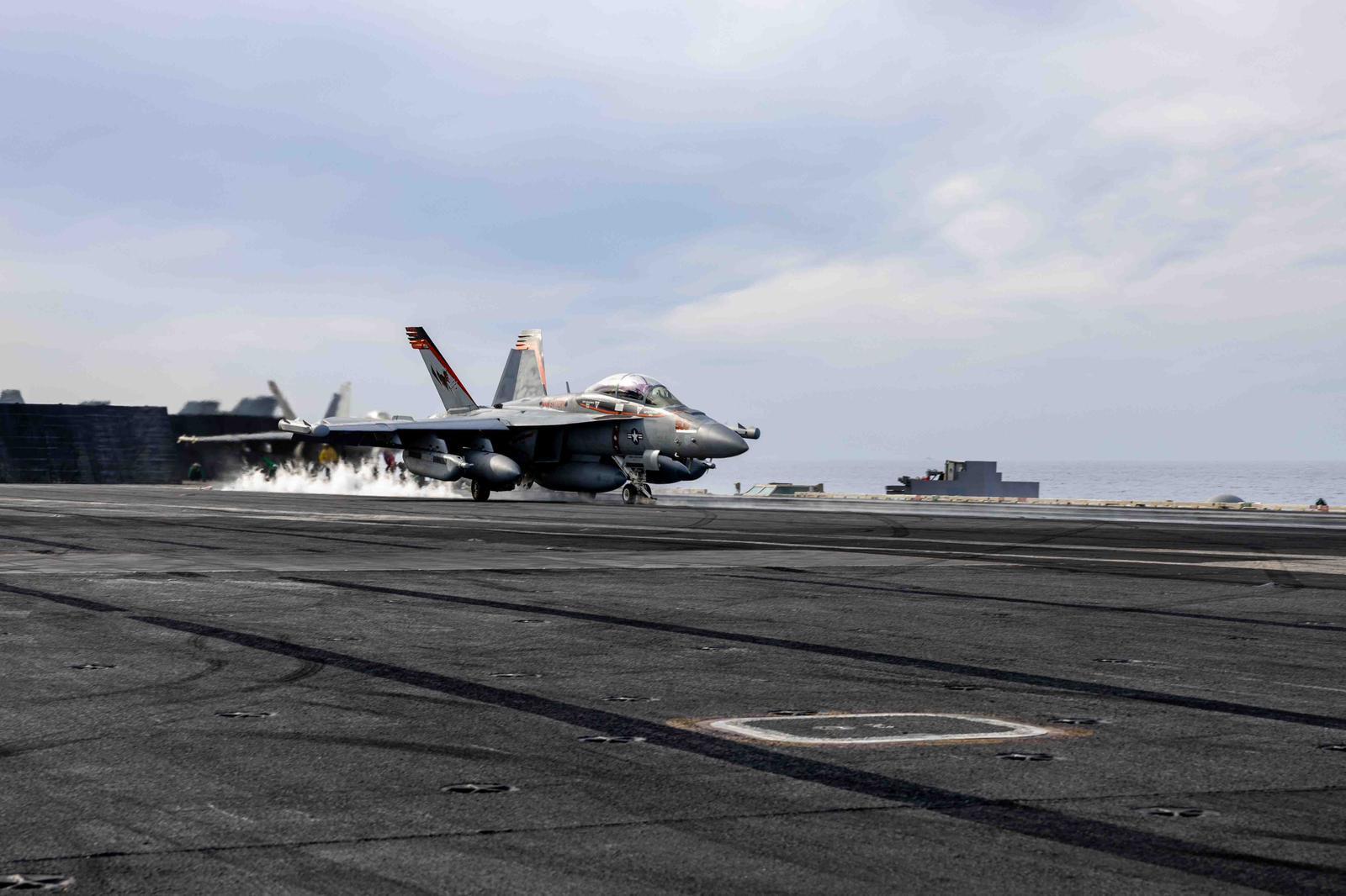 US Navy Super Hornet falls from deck of aircraft carrier