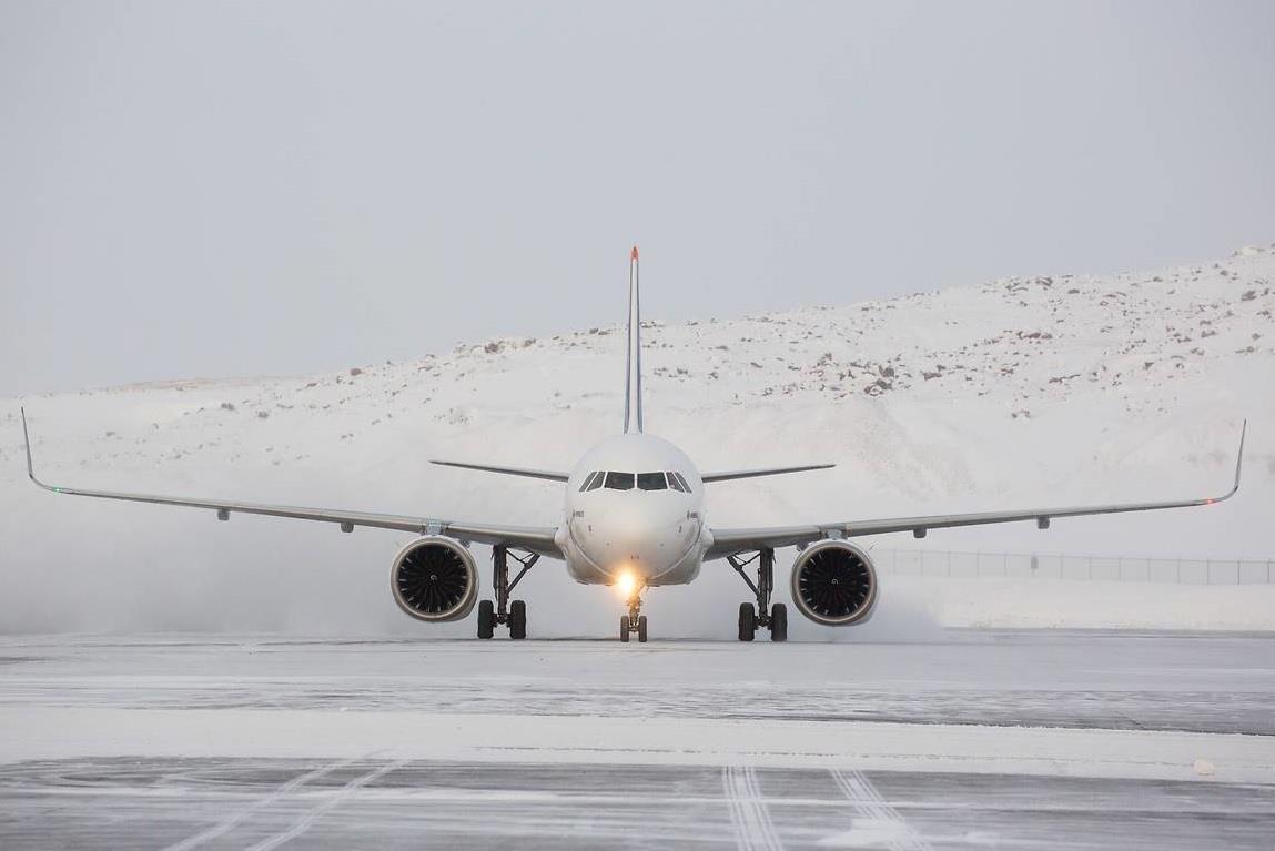 Snow On The Runway With Airplane