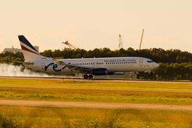 REX_Boeing_737-800_(VH-RYU)_touchdown_at_Brisbane_airport_(BNE_-_YBBN)_2022.08.09