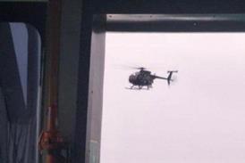 MH-6 Little Bird near MV Bella 1