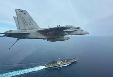 FA-18F over USS Harry S Truman aircraft carrier c US Navy