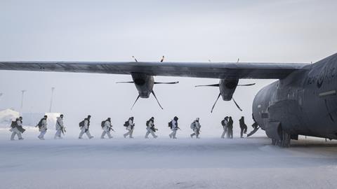 Arctic troops board RCAF C130 c RCAF