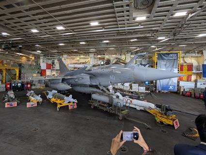 Rafale M in hangar with weapons