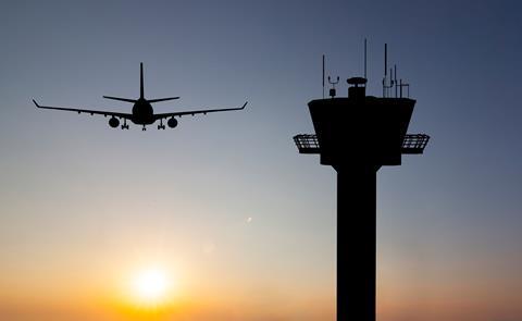 Air traffic control tower sunset