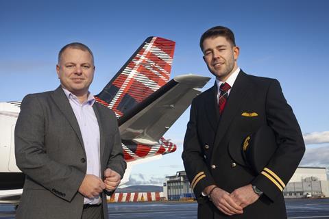 Loganair's Jonathan Hinkles with James Bushe