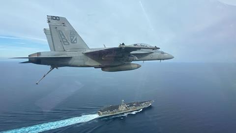 FA-18F over USS Harry S Truman aircraft carrier c US Navy