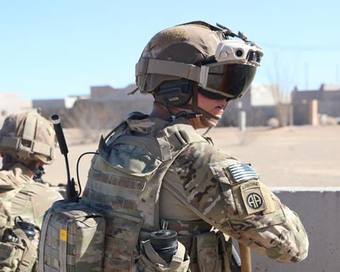 US Army soldier on the ground wearing IVAS goggles square c US Army