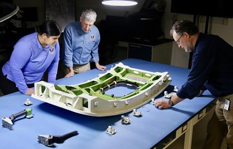 NTSB investigators examine the door plug from Alaska Airlines flight 1282, a Boeing 737-9 MAX.