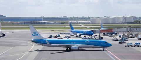 KLM Boeing 737 at Amsterdam Schiphol, with ITA aircraft in background