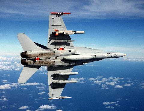 F-18C_with_SLAM-ER_missile_and_AWW-13_pods_in_flight