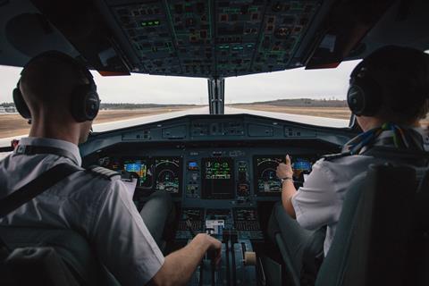 Stock image pilots in cockpit_c_unsplash