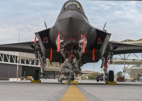 Crew chief performs an inspection on an F-35A Lightning II at Luke Air Force Base