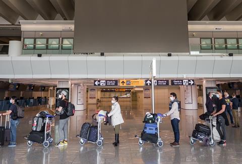 Masks in check-in queue