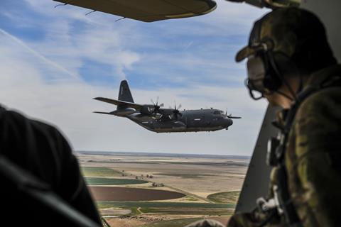 Lockheed Martin MC-130J in formation flight c SOF