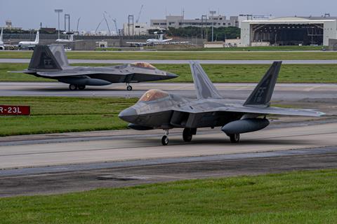 F-22 with external fuel tanks in Kadena air base c USAF