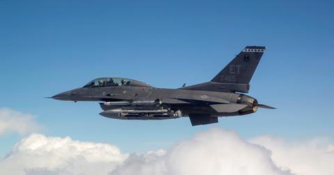 Collaborative Small Diameter Bombs (CSDBs) are carried on the wing of an F-16 fighter c AFRL