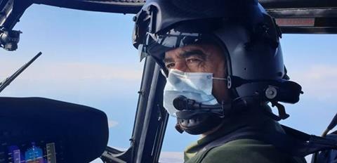 Helicopter pilot with mask