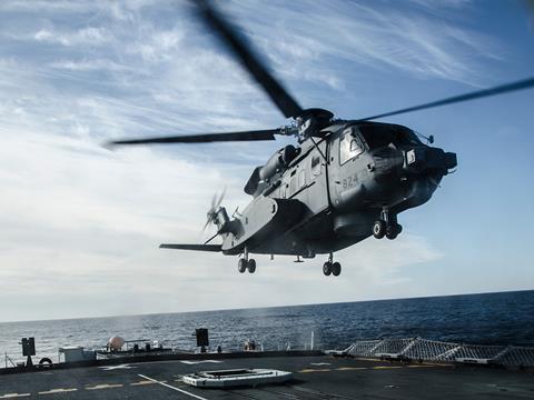 Royal Canadian Air Force CH-148 Cyclone helicopter lands on Royal Canadian Navy ship c RCAF