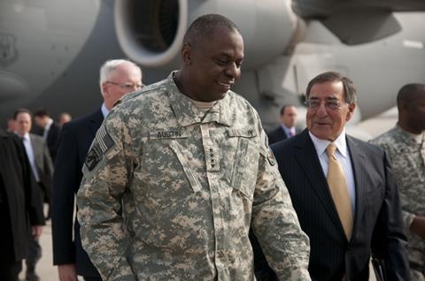 Gen. Lloyd J. Austin III commander United States Forces-Iraq walks with Secretary of Defense Leon Panetta as he arrives in Baghdad for the end of mission ceremony for the Iraq War