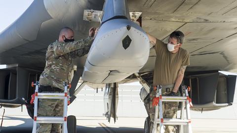 A weapon Loader crew uploads a Joint Air-to-Surface Standoff Missile to an external pylon on a B-1B Lancer c USAF