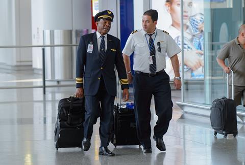 Pilots in airport terminal