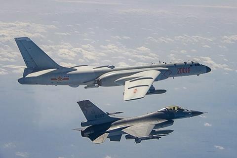 1200px-An_ROC_Airforce_F-16_fighter_jet_shadows_a_PLA_Airforce_Bomber_that_had_approached_the_island_of_Taiwan