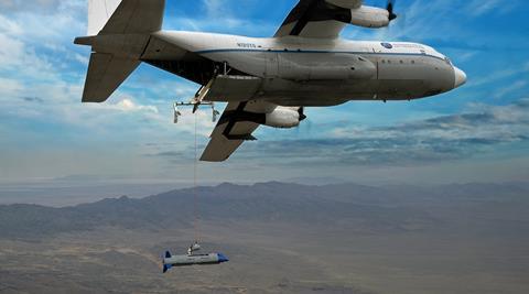 X-61A docked to C-130 c Dynetics