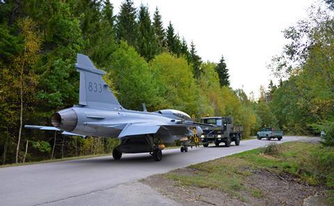 Saab Gripen being pulled through the woods c Royal Swedish Air Force