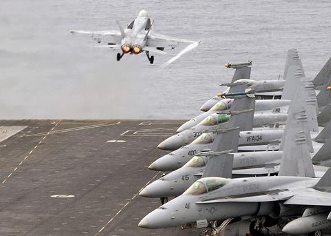 F18_US_Navy_070731-N-9898L-009_An_F-18C_Hornet_attached_to_the_Blue_Blasters_of_Strike_Fighter_Squadron_(VFA)_34,_is_launched_off_the_flight_deck_aboard_Nimitz-class_aircraft_carr