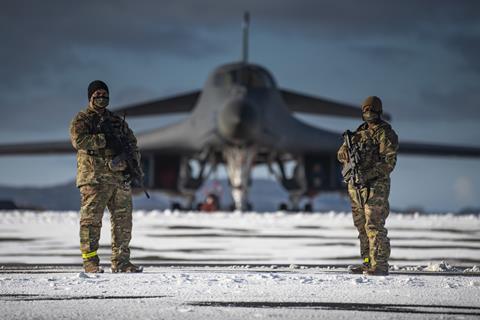 USAF security personel guard B-1B Lancer on the flightline at Ørland Air Force Station in Norway c USAF