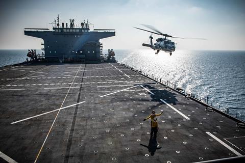 US Navy MH-60R Sea Hawk helicopter taking off from USS Lewis B. Puller Expeditionary Sea Base