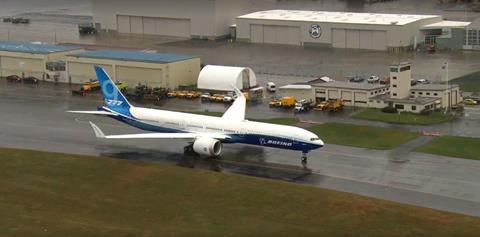 Boeing's 777X test aircraft taxis for first flight at Paine Field on 24 January.