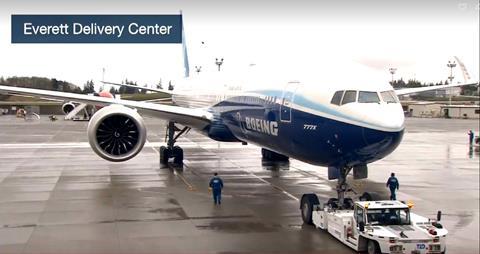 Boeing's 777X test aircraft taxis for first flight at Paine Field.